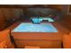 Relaxing backyard hot tub with illuminated jets and an inviting lounge area nearby at 129 Barton Bay Ave, North Las Vegas, NV 89031