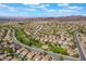 Expansive aerial shot displays a well-planned community with beautiful landscaping and a winding road at 1387 Minuet St, Henderson, NV 89052