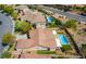 Aerial view capturing the home's layout, pool area, and landscaping within a vibrant, sunny neighborhood at 1387 Minuet St, Henderson, NV 89052