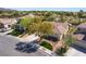 Aerial view of a lovely single-story house with a well-manicured lawn and a lengthy driveway, set in a quiet neighborhood at 1387 Minuet St, Henderson, NV 89052