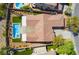 Overhead view of a home, highlighting the roof, the pool and patio area, and the surrounding landscaping at 1387 Minuet St, Henderson, NV 89052