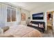 Cozy bedroom featuring a futon, mounted TV, and walk-in closet for ample storage and modern living at 1387 Minuet St, Henderson, NV 89052