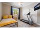 Bright bedroom featuring a full-size bed, exercise equipment, and closet at 1387 Minuet St, Henderson, NV 89052