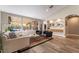 Bright living room with stylish furniture, a large windows overlooking backyard, and modern decor at 1387 Minuet St, Henderson, NV 89052