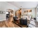 Spacious living room with wood floors, arched doorways, and backyard views at 1387 Minuet St, Henderson, NV 89052