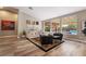 Inviting living room featuring a vaulted ceiling, large windows, and modern furnishings at 1387 Minuet St, Henderson, NV 89052