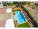 Aerial view of a private pool and spa with lounge chairs, surrounded by lush artificial turf and desert landscaping at 1387 Minuet St, Henderson, NV 89052