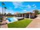 Beautiful backyard pool and spa area with lush landscaping at 1387 Minuet St, Henderson, NV 89052