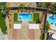 Overhead view featuring a modern pool with spa, patio area, and lush landscaping in a private backyard at 1387 Minuet St, Henderson, NV 89052