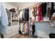 Spacious walk-in closet featuring custom shelving, ample hanging space, and organized storage solutions at 1387 Minuet St, Henderson, NV 89052
