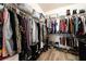 Well-organized walk-in closet providing ample storage for clothes, shoes, and accessories at 1387 Minuet St, Henderson, NV 89052