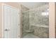 This bathroom showcases a newly renovated shower with stone tile at 1505 Irene Dr, Boulder City, NV 89005
