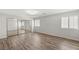 Bright bedroom featuring wood-style flooring and a large mirrored closet at 1505 Irene Dr, Boulder City, NV 89005