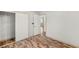 Bedroom featuring modern wood flooring, walk-in closet, and bright neutral walls at 1505 Irene Dr, Boulder City, NV 89005