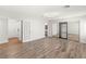 Spacious bedroom with wood-look flooring, mirrored closet, and ensuite access at 1505 Irene Dr, Boulder City, NV 89005