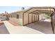Long carport alongside home's exterior offers ample covered parking at 1505 Irene Dr, Boulder City, NV 89005