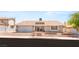 Charming single-story home featuring a landscaped front yard and a two-car attached garage at 1505 Irene Dr, Boulder City, NV 89005