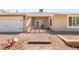 The front yard boasts easy-care landscaping, featuring decorative rock and a welcoming entryway with stone accents at 1505 Irene Dr, Boulder City, NV 89005