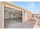 View of the open detached garage showing storage and a white door to the backyard at 1505 Irene Dr, Boulder City, NV 89005