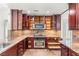This spacious kitchen features wooden cabinets and stainless steel appliances at 1505 Irene Dr, Boulder City, NV 89005