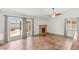 Cozy living room with sliding glass doors to backyard and a decorative stone fireplace at 1505 Irene Dr, Boulder City, NV 89005