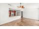 Living room with open kitchen concept, ceiling fan, and tile flooring at 1505 Irene Dr, Boulder City, NV 89005