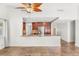 The living room boasts an open concept with a kitchen, ceiling fan, and tile flooring at 1505 Irene Dr, Boulder City, NV 89005