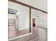 Open-concept living room with vaulted ceilings, wood beams, and modern finishes at 1505 Irene Dr, Boulder City, NV 89005