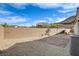 Backyard with block wall, stone pavers, gravel and air conditioning unit at 161 Cabo Cruces Dr, Henderson, NV 89011
