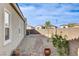 Gravel backyard with pavers, desert landscaping and block wall surround at 161 Cabo Cruces Dr, Henderson, NV 89011