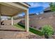 The covered patio extends to a low-maintenance backyard with pavers and synthetic grass at 161 Cabo Cruces Dr, Henderson, NV 89011