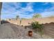 Gravel backyard with pavers, desert landscaping and block wall surround at 161 Cabo Cruces Dr, Henderson, NV 89011