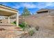 Paver patio with a covered area overlooks the low-maintenance yard at 161 Cabo Cruces Dr, Henderson, NV 89011