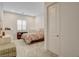 Bedroom with a comfortable bed, carpeted floors, and a window with shutters at 161 Cabo Cruces Dr, Henderson, NV 89011