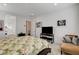Inviting bedroom featuring neutral tones, a comfortable sitting area, and ample natural light at 161 Cabo Cruces Dr, Henderson, NV 89011