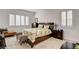 Comfortable bedroom with a plush bed, shuttered windows, and coordinated furnishings at 161 Cabo Cruces Dr, Henderson, NV 89011