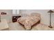Cozy bedroom showcasing a comfortable bed, shuttered window, and soft carpeting at 161 Cabo Cruces Dr, Henderson, NV 89011