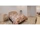 Bedroom featuring a comfortable bed, soft carpeting, and a decorative chair at 161 Cabo Cruces Dr, Henderson, NV 89011