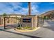 Community entrance with 'The Bluffs' sign, stone accents, and iron gates at 161 Cabo Cruces Dr, Henderson, NV 89011