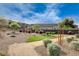 Landscaped community area with decorative bushes, trees and walking paths at 161 Cabo Cruces Dr, Henderson, NV 89011