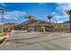 Community entrance featuring lush landscaping, desert surroundings, and clear blue skies at 161 Cabo Cruces Dr, Henderson, NV 89011