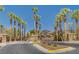 Gated community entrance surrounded by palm trees and desert landscaping at 161 Cabo Cruces Dr, Henderson, NV 89011