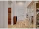Hallway featuring wood-look flooring and view to the home entry door at 161 Cabo Cruces Dr, Henderson, NV 89011