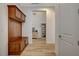 Hallway with tile flooring, hall tree, and view of display cabinet at 161 Cabo Cruces Dr, Henderson, NV 89011