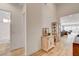 Hallway with wood flooring and views to bathroom and living room at 161 Cabo Cruces Dr, Henderson, NV 89011
