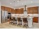 Modern kitchen with stainless steel appliances, a center island with seating, and ample cabinet space at 161 Cabo Cruces Dr, Henderson, NV 89011