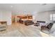 Expansive living space that seamlessly connects the living room with the modern kitchen and island at 161 Cabo Cruces Dr, Henderson, NV 89011