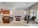 Open living room with lots of natural light, a modern fireplace, and comfortable seating arrangements at 161 Cabo Cruces Dr, Henderson, NV 89011