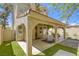 Exterior view highlights a covered patio that blends seamlessly with the well-kept landscaping at 1833 Winners Cup Dr, Las Vegas, NV 89117