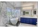 Bright bathroom features a modern soaking tub, glass shower and double sink vanity at 1833 Winners Cup Dr, Las Vegas, NV 89117